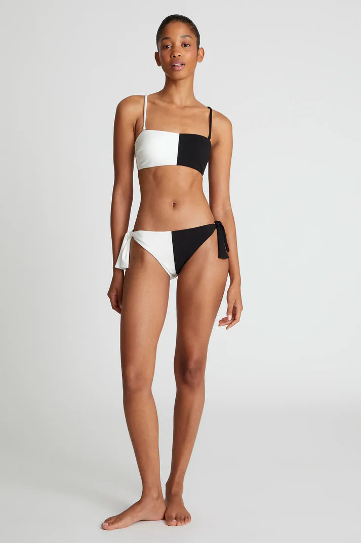 Slip bikini bicolore nero con fiocco